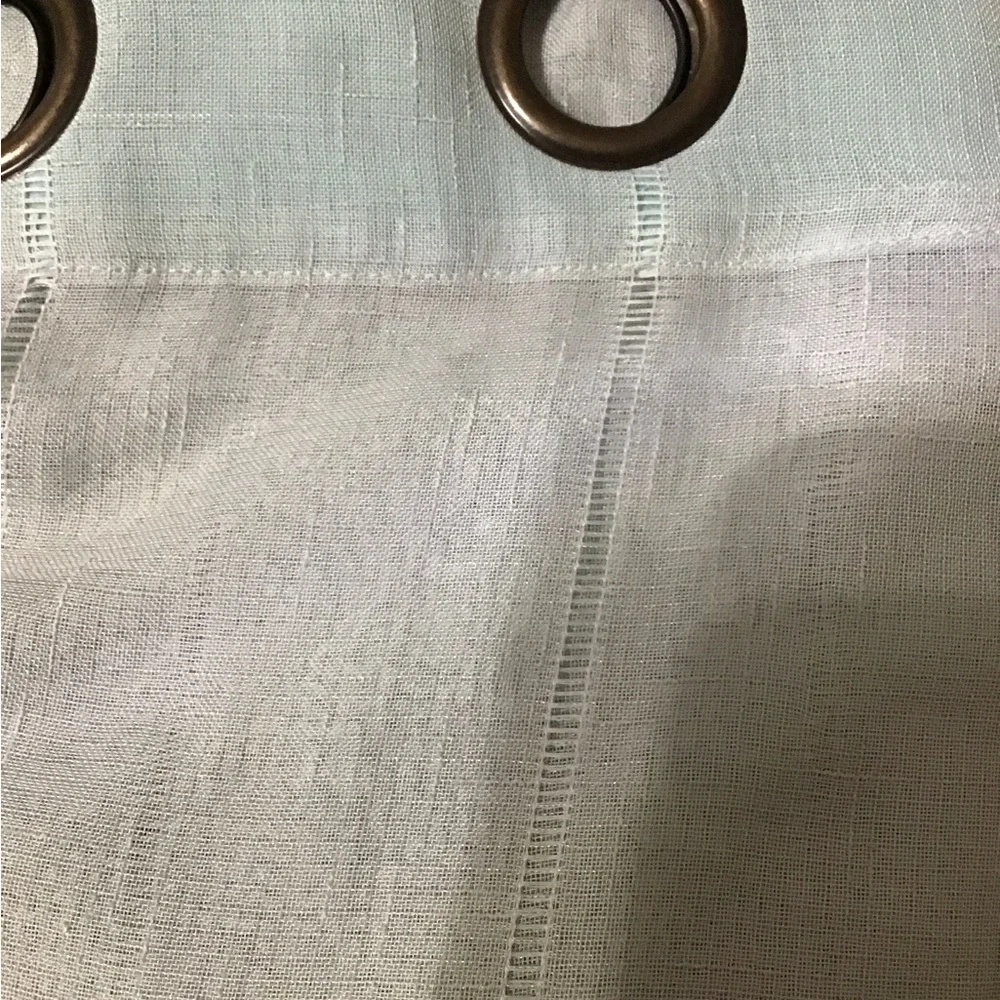 A total of 4 mint green 37 x 96 sheer Curtain panels with Bronze Grommets